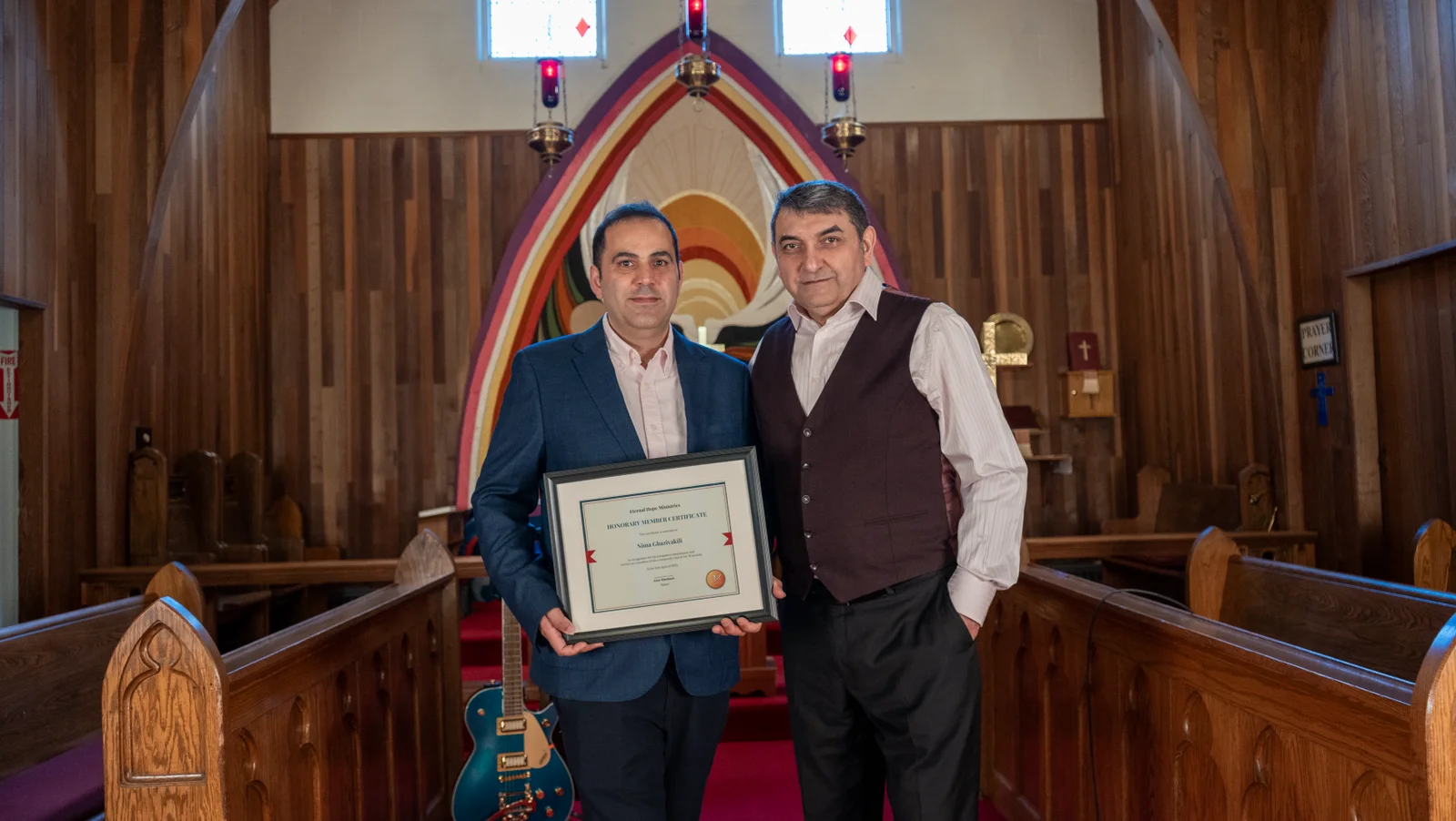 Portrait of two people inside Eternal Hope church