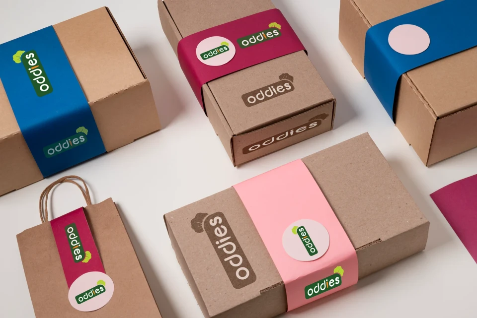 Oddies branded boxes and shopping bag — packaging design mockup