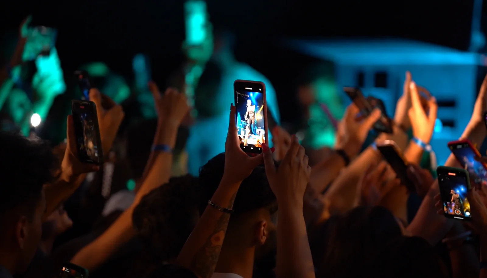 Audience filming the concert on phones